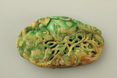 A green mottled jade carving of fruits, 20th C.