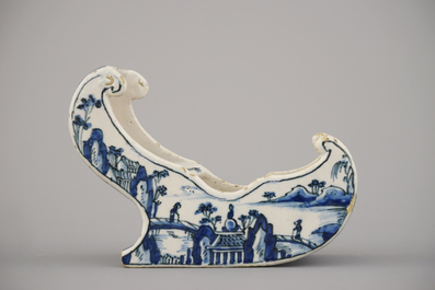 A rare Dutch Delft blue and white pipe holder, modelled as a sleigh, 18th C.