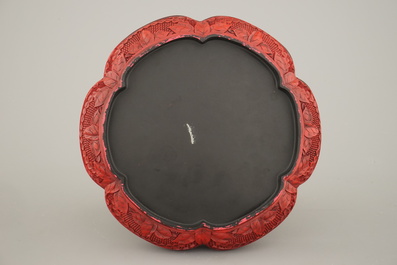 A Chinese carved cinnabar lacquer box and cover, 19th C.