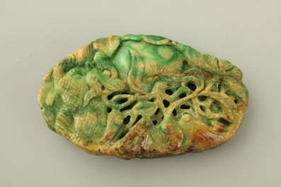 A green mottled jade carving of fruits, 20th C.