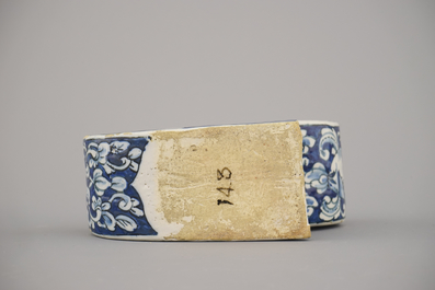 A rare Dutch Delft blue and white pipe holder, modelled as a sleigh, 18th C.