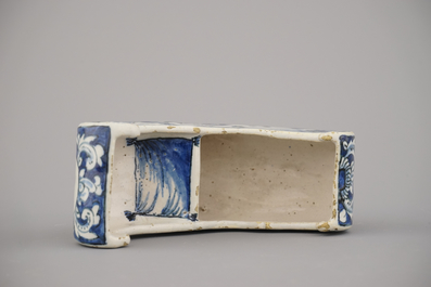 A rare Dutch Delft blue and white pipe holder, modelled as a sleigh, 18th C.
