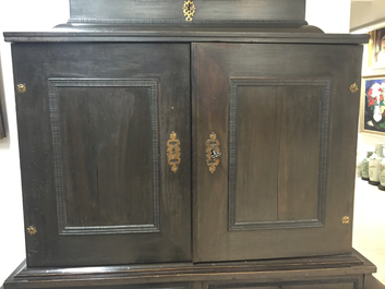 A South-German ebony veneer and gilded copper cabinet, 17th C.