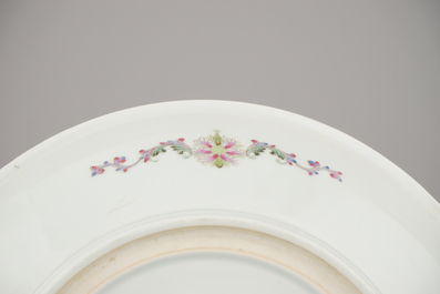 A fine large Chinese porcelain charger with ladies in a garden, 20th C.