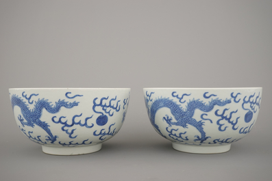A pair of Chinese porcelain blue and white dragon bowls, 19th C.