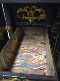 A South-German ebony veneer and gilded copper cabinet, 17th C.