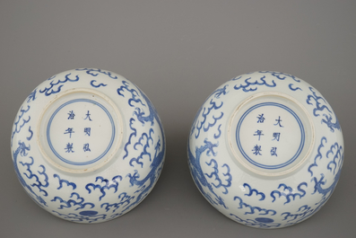 A pair of Chinese porcelain blue and white dragon bowls, 19th C.