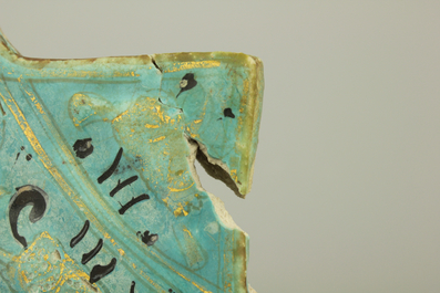 A turquoise ground Lajvardina cold painted star-shaped tile, 14th C.
