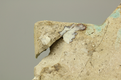 A turquoise ground Lajvardina cold painted star-shaped tile, 14th C.