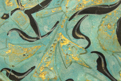 A turquoise ground Lajvardina cold painted star-shaped tile, 14th C.