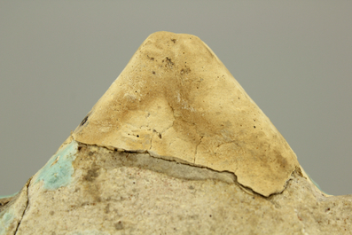 A turquoise ground Lajvardina cold painted star-shaped tile, 14th C.