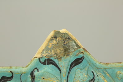 A turquoise ground Lajvardina cold painted star-shaped tile, 14th C.