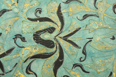 A turquoise ground Lajvardina cold painted star-shaped tile, 14th C.