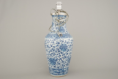 A Chinese porcelain blue and white vase with lotus scrolls, mounted as lamp, 19th C.