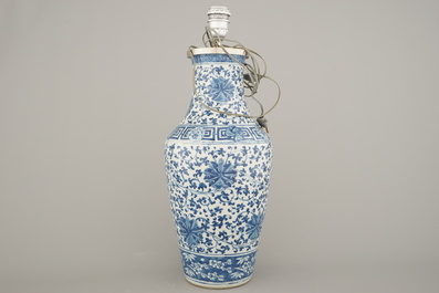 A Chinese porcelain blue and white vase with lotus scrolls, mounted as lamp, 19th C.
