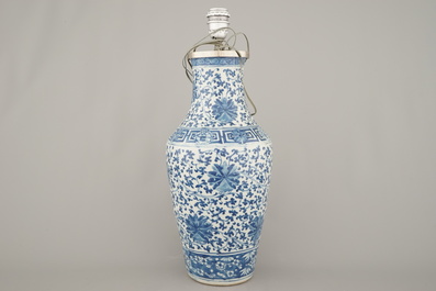 A Chinese porcelain blue and white vase with lotus scrolls, mounted as lamp, 19th C.