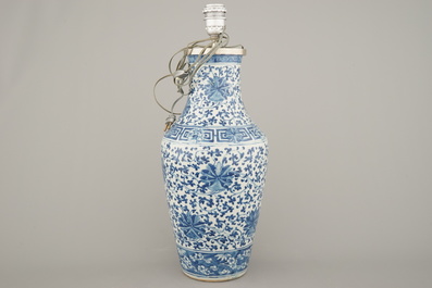 A Chinese porcelain blue and white vase with lotus scrolls, mounted as lamp, 19th C.