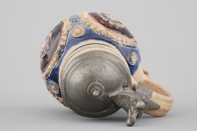 A manganese and blue Westerwald pewter-mounted globular jug, 17th C.