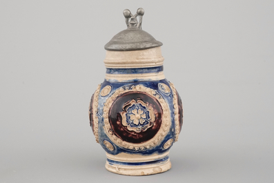 A manganese and blue Westerwald pewter-mounted globular jug, 17th C.