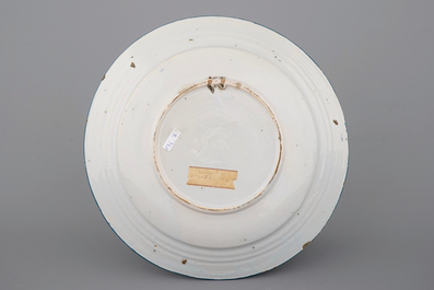 A Brussels faience blue-ground plate with floral decoration, 18th C.