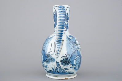 A Dutch Delft blue and white chinoiserie jug, 17th C.