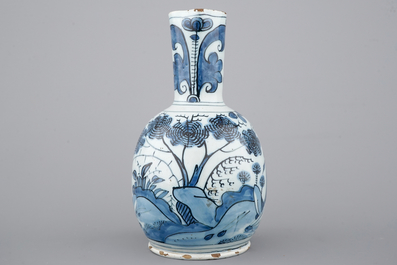 A Dutch Delft blue and white chinoiserie jug, 17th C.
