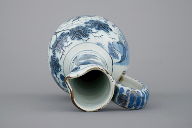A Dutch Delft blue and white chinoiserie jug, 17th C.