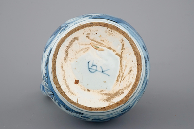 A Dutch Delft blue and white chinoiserie jug, 17th C.