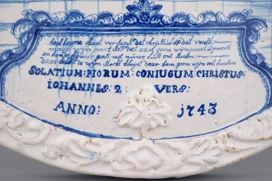 A massive dated Amsterdam Delftware plaque with "The wedding at Cana", ca. 1743