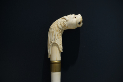 An Anglo-Indian ivory and brass walking stick or cane with a lion's head, 19th C.