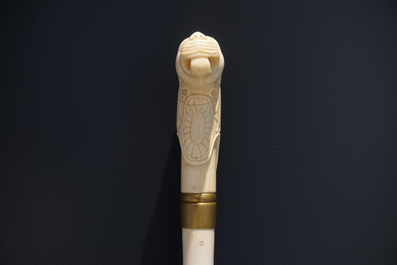 An Anglo-Indian ivory and brass walking stick or cane with a lion's head, 19th C.