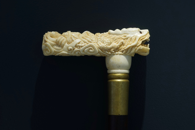 A Chinese carved ivory and wood walking stick or cane with a dragon's head, 19th C.