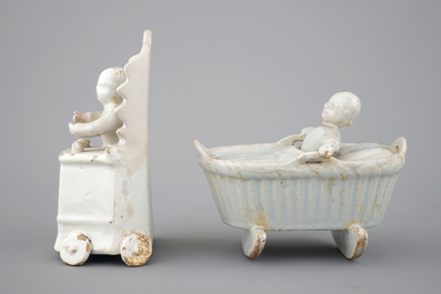 Two monochrome white Dutch Delft figures of children, 18th C.