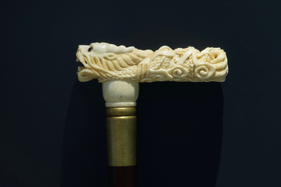 A Chinese carved ivory and wood walking stick or cane with a dragon's head, 19th C.