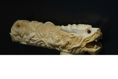 A Chinese carved ivory and wood walking stick or cane with a dragon's head, 19th C.