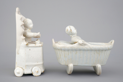 Two monochrome white Dutch Delft figures of children, 18th C.