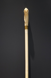 An Anglo-Indian ivory and brass walking stick or cane with a lion's head, 19th C.