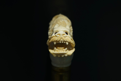 A Chinese carved ivory and wood walking stick or cane with a dragon's head, 19th C.