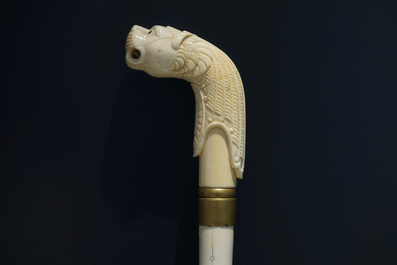An Anglo-Indian ivory and brass walking stick or cane with a lion's head, 19th C.
