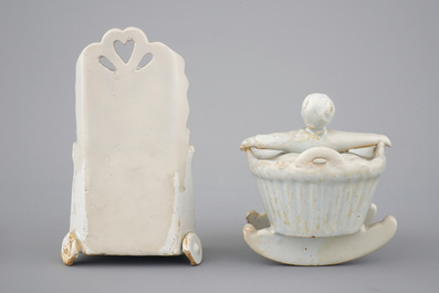 Two monochrome white Dutch Delft figures of children, 18th C.