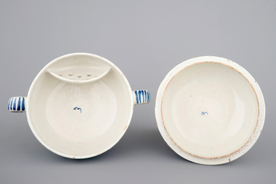 A dated Dutch Delft blue and white round bowl with cover for spiced wine, ca. 1709