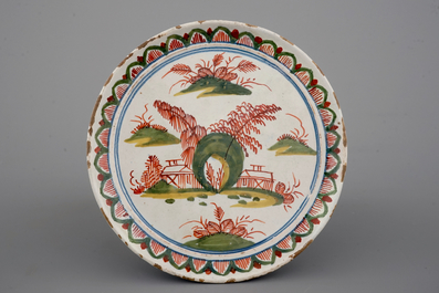 A Dutch Delft tripod saucer in cashemire palette, ca. 1700