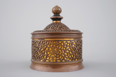 A cylindrical brass and bronze box and cover, 16/17th C., probably Venice
