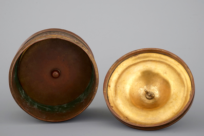 A cylindrical brass and bronze box and cover, 16/17th C., probably Venice