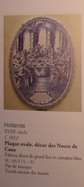 A massive dated Amsterdam Delftware plaque with "The wedding at Cana", ca. 1743