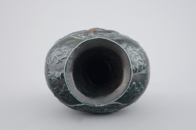 A Chinese black glazed relief-moulded vase, 19/20th C.