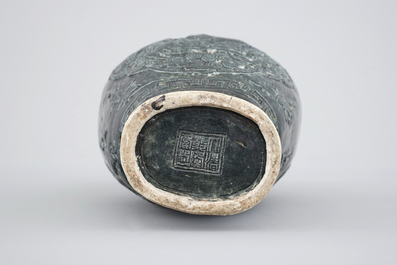A Chinese black glazed relief-moulded vase, 19/20th C.