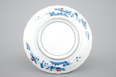 A Japanese kakiemon porcelain fluted plate, 18th C.
