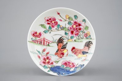 A Chinese famille rose porcelain cup and saucer with cocks, Yongzheng, 1722-1735