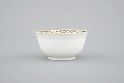 A Chinese grisaille and gilt export porcelain armorial cup and saucer, 18th C